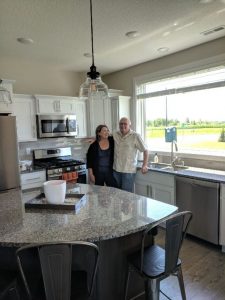 Chuck and Kelly enjoying their new kitchen.
